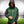 Man wearing a green and black ActionHeat Green Bay Packers hooded varsity jacket