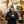 Man wearing ActionHeat jacket and Houston Texans beanie holding a steaming cup outdoors