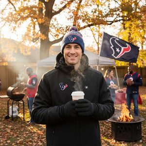 Man wearing ActionHeat jacket and Houston Texans beanie holding a steaming cup outdoors