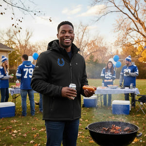 Man wearing Indianapolis Colts jacket grilling at a tailgate party