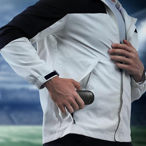 ActionHeat jacket with person placing a battery pack into the side pocket
