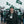 Man wearing ActionHeat jacket and New York Jets beanie holding a coffee cup in a snowy stadium parking lot
