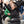 Woman wearing an ActionHeat black vest with Philadelphia Eagles logo cheering in stadium bleachers