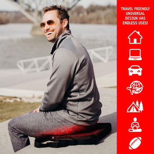 Man sitting on an ActionHeat heated seat cushion outdoors with universal use icons on the side