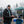 Fan wearing Philadelphia Eagles gear holding a football at a tailgate party