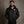 Man wearing a black ActionHeat Pittsburgh Steelers heated jacket