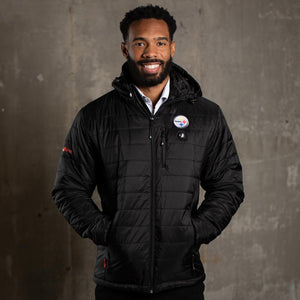Man wearing a black ActionHeat Pittsburgh Steelers heated jacket