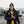Man wearing ActionHeat jacket and Steelers gear holding a football in the snow