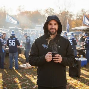 Man wearing ActionHeat Tennessee Titans hooded jacket holding a steaming mug at a tailgate