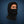 ActionTech black fleece balaclava with adjustable drawstring worn by a man against a blue background