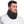 Man wearing a black fleece neck warmer with an adjustable drawstring