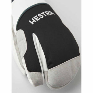Hestra white and black three finger ski glove with grey suede palm reinforcement