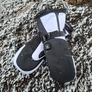 Aheata black and white heated mittens on snowy ground