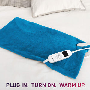 Aheata blue electric heating pad with digital controller on a white bed