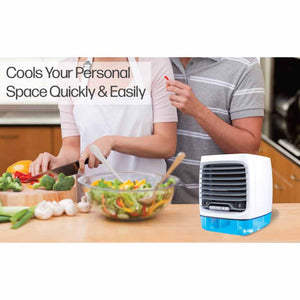 Ontel Arctic Air portable cooler on a kitchen counter next to people preparing food