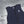 AlphaCool navy blue cooling vest with zipper and logo on a grey background with ice cubes