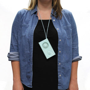 AlphaCool light blue wearable neck fan hanging on a lanyard