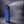 AlphaCool blue misting water bottle with text callouts for rapid cooling mist, water bottle use, and two misting speeds