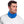 Man wearing a blue AlphaCool neck gaiter