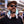 Man wearing a white AlphaCool portable neck fan outdoors
