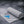 AlphaCool grey cooling towel with Detroit Lions logo and text overlays describing cooling benefits