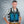 Man wearing an AlphaCool cooling vest with blue gel inserts