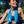 Woman wearing a blue AlphaCool cooling towel around her neck outdoors