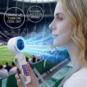 AlphaCool handheld fan held by a person in a stadium with text overlays about charging and cooling duration