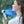 AlphaCool handheld fan with digital display blowing air on a person