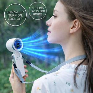 AlphaCool handheld fan with digital display blowing air on a person