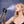 AlphaCool misting water bottle spraying mist onto a woman face