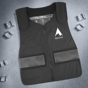 Black Alphacool cooling vest with reflective side straps on a grey background with ice cubes