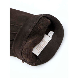 Hestra brown suede glove interior showing size seven label and material composition