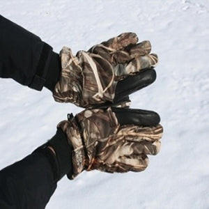 Glacier Glove camouflage winter gloves with black palms worn against a snowy background