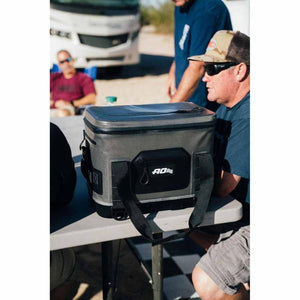 AO Coolers soft cooler on a table with people in the background