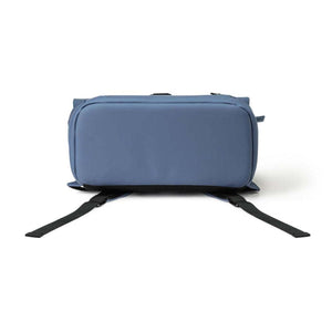 Bottom view of a blue backpack with black straps