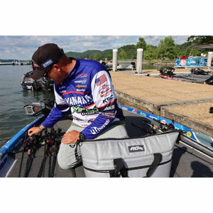 Angler on a boat with an AO Coolers soft cooler bag