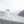Skier carving through deep powder snow in Arctic Volt gear