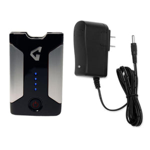 Portable battery pack with power button and LED indicators next to a wall charger