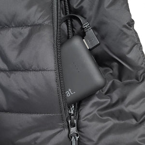 ActionHeat power bank connected to a USB cable inside a black quilted jacket pocket
