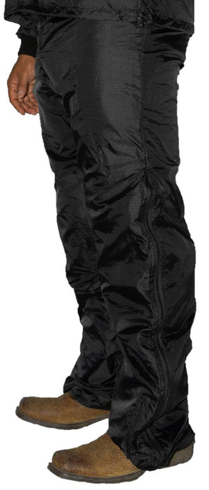 California Heat black waterproof overpants with side zippers worn over boots