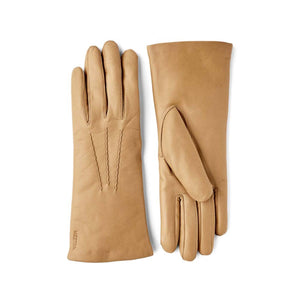 Hestra tan leather gloves with decorative stitching on the back