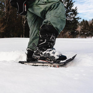 Person wearing Baffin winter boots and snowshoes in deep snow