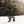 Person wearing Baffin winter boots and outdoor gear walking through deep snow