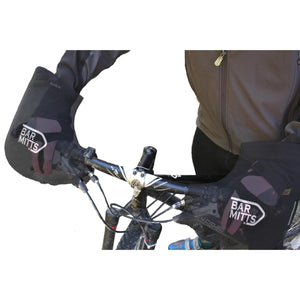 Cyclist hands inside black Bar Mitts handlebar covers on a mountain bike