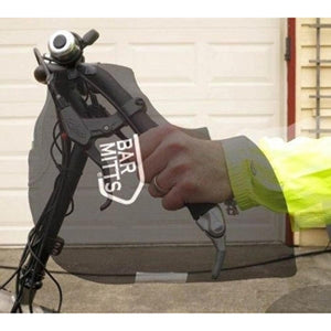 Hand inside a Bar Mitts handlebar cover on a bicycle