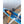 Bar Mitts covers on rowing oars in a blue rowing shell on a sandy shore