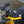 Bar Mitts handlebar covers installed on a yellow motorcycle
