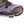 Hillsound traction device attached to the front of a hiking boot