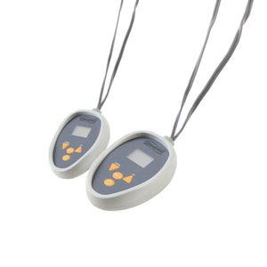 Two Beautyrest wired remote controls with digital displays and orange buttons